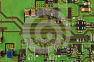 Microelectronic circuit board with components from modern device close up.