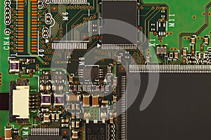 Microelectronic circuit board from digital device close up.