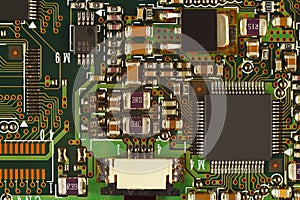 Microelectronic circuit board with microchips closeup.