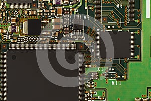 Microelectronic circuit board with microchips from modern device close up.