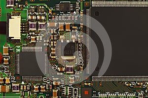 Microelectronic circuit board from modern device close up.