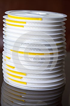 Microelectronics Concepts. Stack of SMD or Surface Mount Components On Tape and Reel Holders in One Batch Together