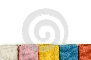Microfiber cleaning cloth. Isolated.Colored microfiber cloths, lying in a row.