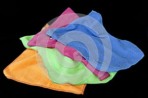 Microfiber cleaning cloths in orange color, black back ground,