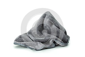 Microfiber cloth  on pure white background. Dirty rag made from soft fabric with cleaner equipment