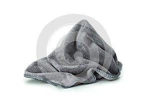 Microfiber cloth  on pure white background. Dirty rag made from soft fabric with cleaner equipment photo