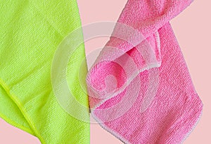 Microfiber cloths isolated on pink background, tools for cleaning and cleanliness. The concept of spring cleaning, flat lay