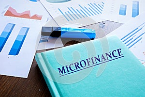 MICROFINANCE phrase on the notepad