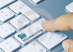 Microlearning - Inscription on Blue Keyboard Key