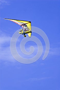 Microlight in blue sky