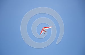 Microlight trike flying with blue sky