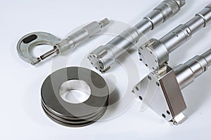 Set of micrometers on a white background. Micrometer with check ring