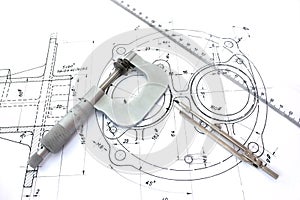 Micrometer compass and ruler on blueprint