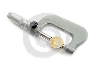 The micrometer measures Euro a coin.