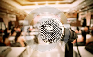 Microphone on abstract blurred of front podium and speech in seminar room or speaking conference hall light, Event meeting photo