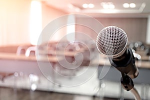 Microphone on abstract blurred of speech in seminar room