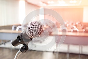 Microphone on abstract blurred of speech in seminar room