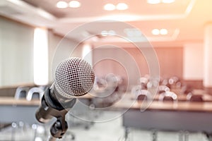 Microphone on abstract blurred of speech in seminar room