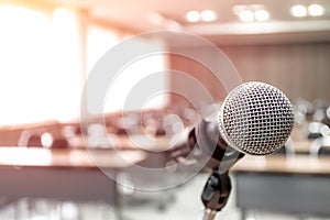 Microphone on abstract blurred of speech in seminar room