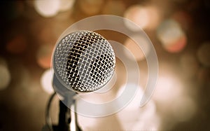 Microphone on abstract blurred of speech in seminar room or speaking conference hall light, Event concert bokeh background