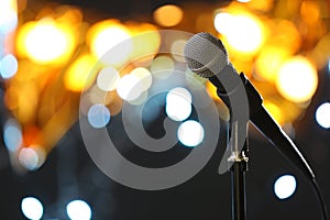 Microphone against festive lights, space for text