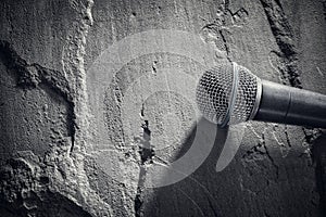 Microphone background on stone textured surface