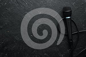Microphone on black stone table. Studio. Top view.