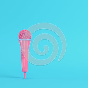 Microphone on bright blue background in pastel colors