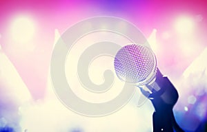 Microphone and bright colorful stage lights