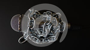 Microphone and chain. Freedom of the press is at risk concept - World press freedom day concept