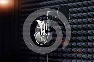 Microphone close - up on the background of a professional recording Studio. Workplace singers and musicians. Microphone stand and