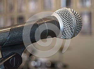 Microphone close-up, used by speaker to speak in conference room, seminar, University, lectures, blurred background