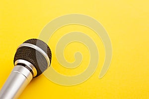 Microphone closeup on yellow photo