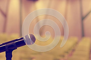 Microphone in concert hall or conference room with defocused bok