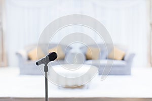 Microphone in concert hall or conference room soft and blur style for background. Microphone over the Abstract blurred photo of co