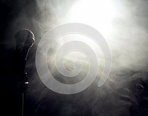 Microphone at edge of smoke and fog in light