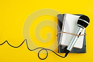 Microphone and empty open note book photo