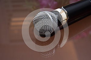 A microphone on the glass table in the music room