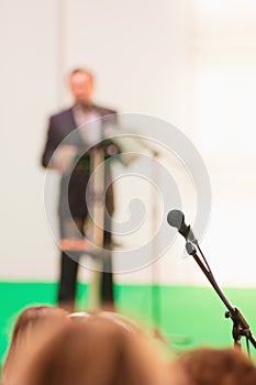 Microphone in the hall and out of focus protruding.