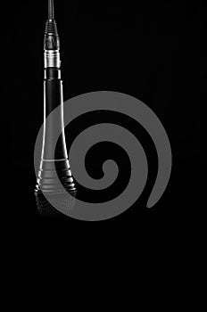 Microphone hanging in black room