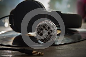 Microphone and headphones on vinyl record