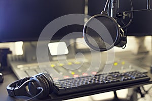 Microphone and headset in radio station broadcasting studio