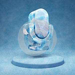 Microphone icon. Cracked blue Ice Microphone symbol on blue snow podium