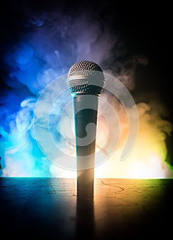 Microphone karaoke, concert . Vocal audio mic in low light with blurred background. Live music, audio equipment. Karaoke concert,