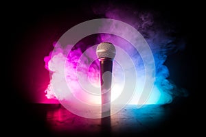 Microphone karaoke, concert . Vocal audio mic in low light with blurred background. Live music, audio equipment. Karaoke concert,