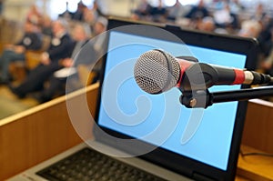 Microphone and laptop screen at the Conference.