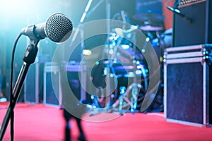 Microphone and music instrument on stage background