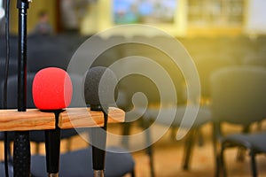 Microphone over the blurred business conference hall or seminar