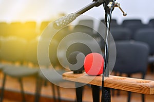 Microphone over the blurred business conference hall or seminar