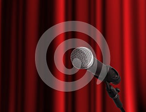 Microphone over red curtain